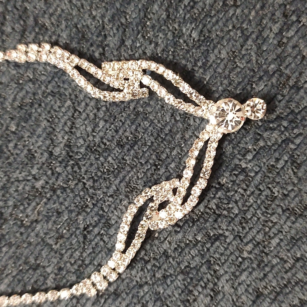 Beautiful and sparkly silver tone necklace/earring matching set. NWOT.